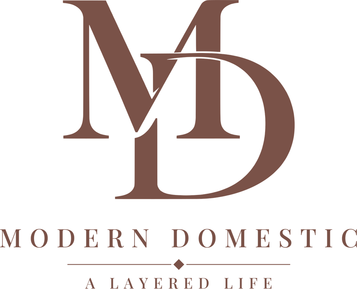 The MD monogram above the words Modern Domestic, A Layered Life